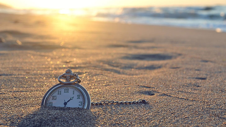 clocks-beach-sand-sunlight-wallpaper-preview